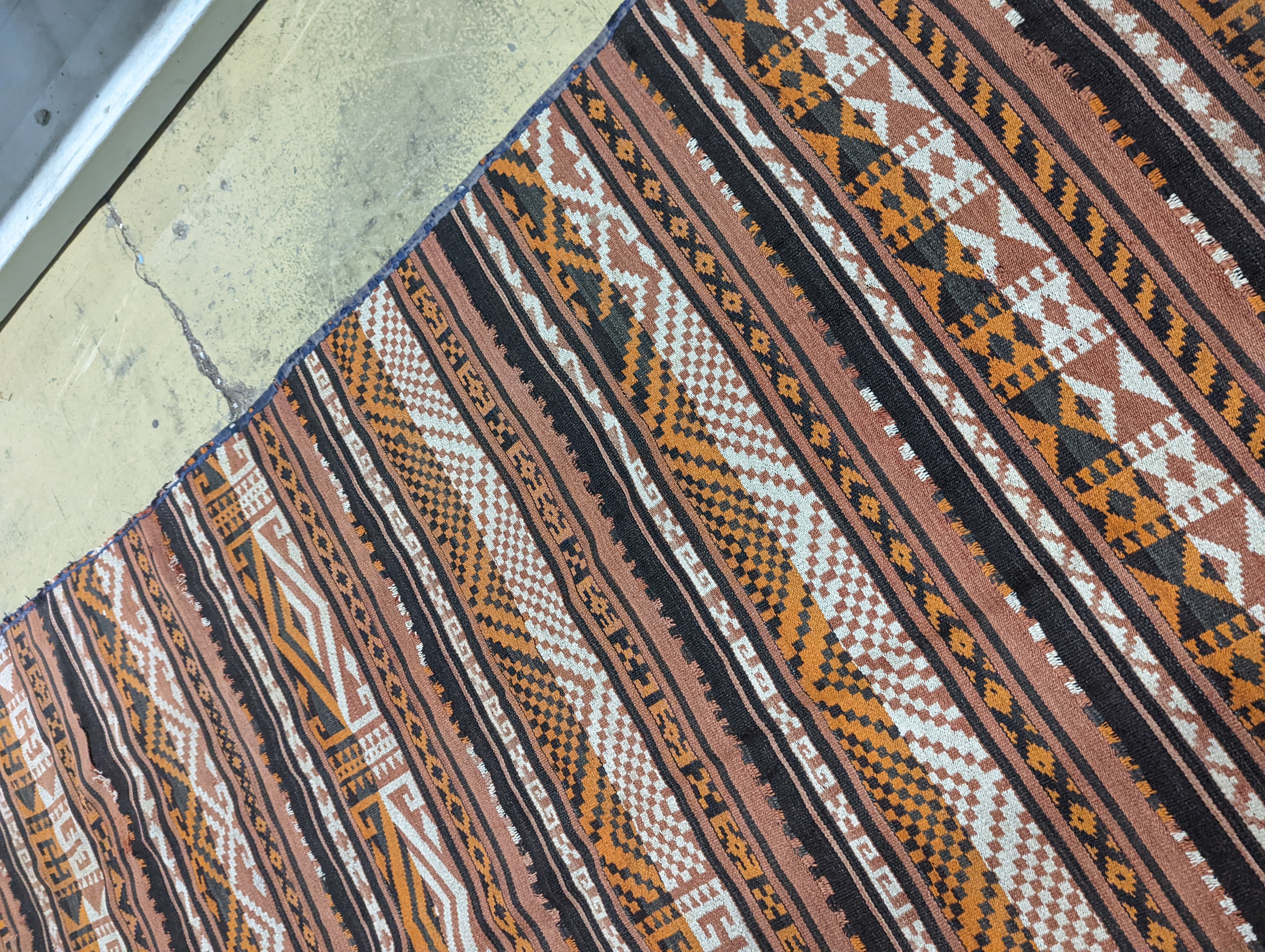 A polychrome flatweave carpet, approx. 330 x 180cm